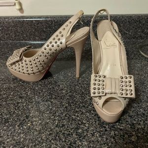 Beige, bowed and studded Christian Louboutin’s